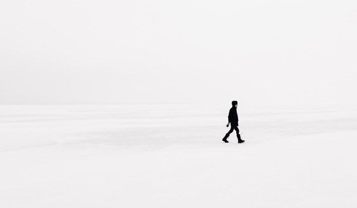 minimalist-website design still in fashion displays a picture of a man in the distance